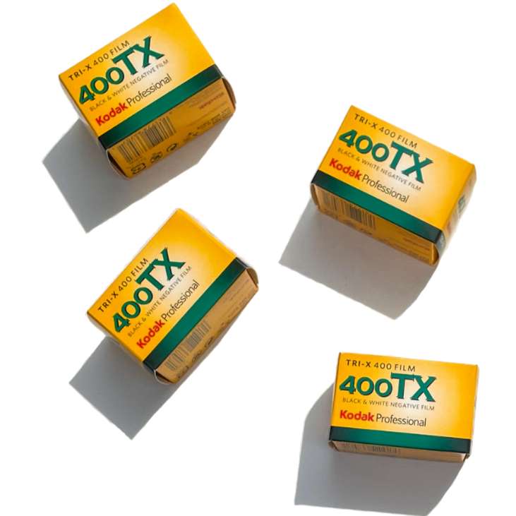 A black and white negative film roll of Kodak Professional Tri-X 400, sitting on a white background with the Kodak logo clearly visible.
